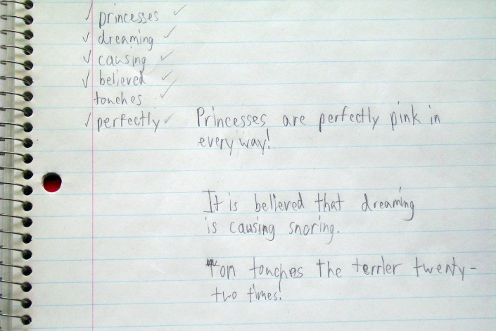 Notebook with child's handwritten sentences