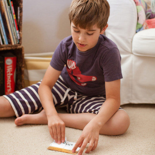 boy playing with a word flipper