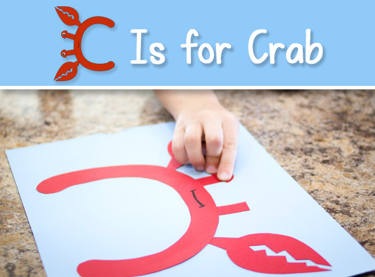 child assembling C Is for Crab craft
