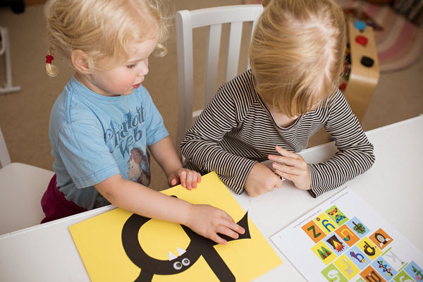 children assemble their lowercase letter b craft