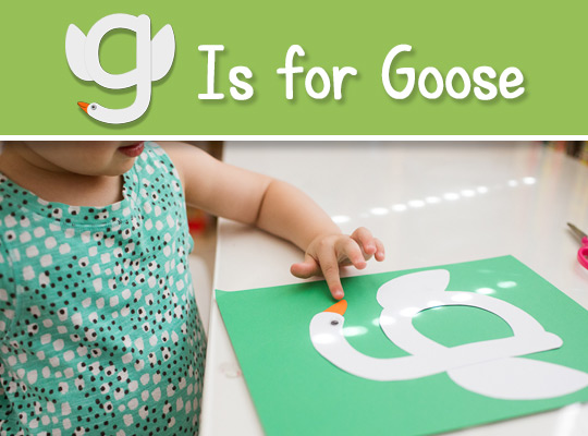 child touches gooses beak lowercase g craft