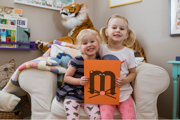 children display their uppercase letter M craft