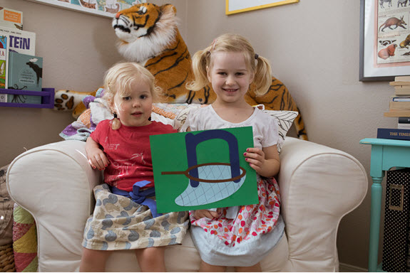 children show off their uppercase letter N craft
