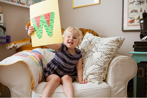 child displays her lowercase w craft