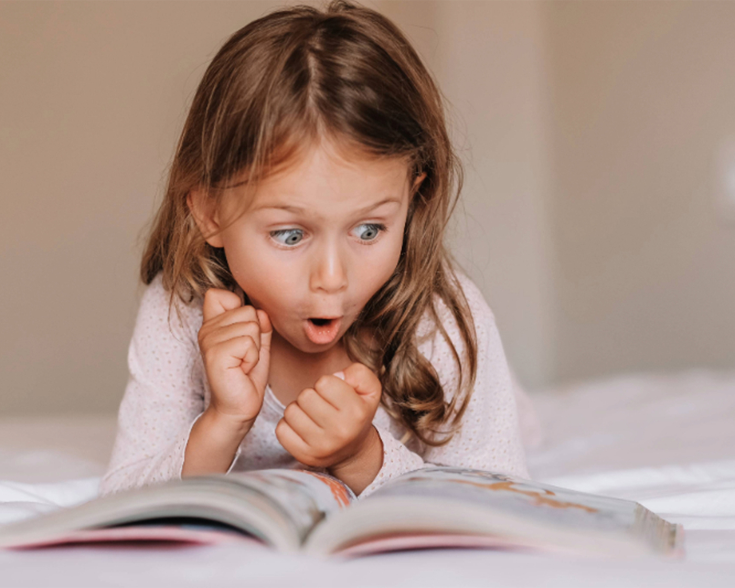 A child reading three-letter words